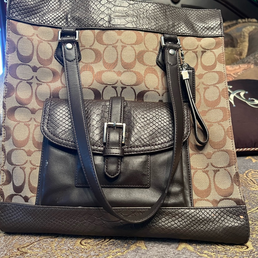 Beautiful Coach bag. One outside pocket two inside pockets. Excellent Condition